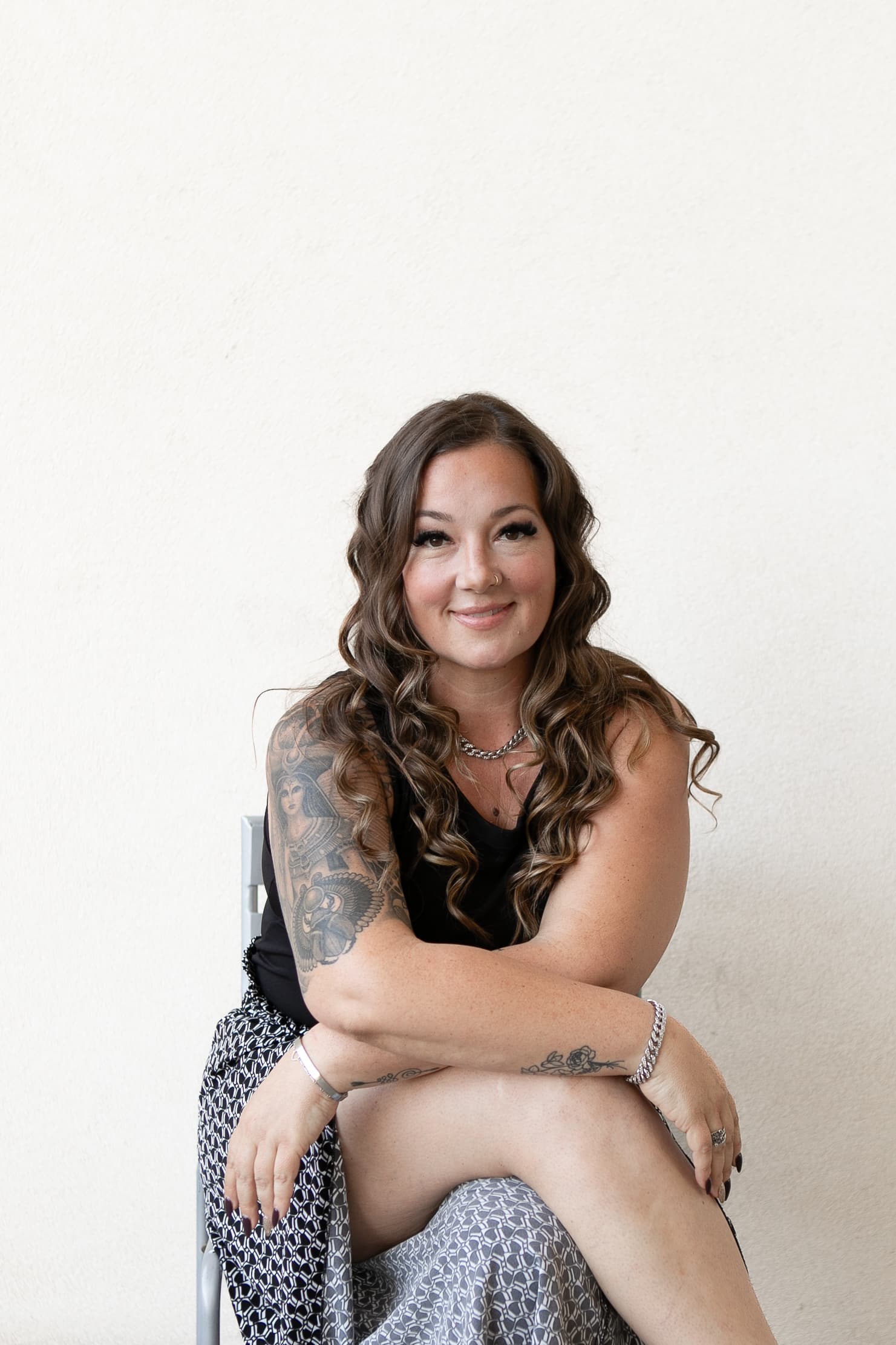 Kaleigh Williams, seated portrait with soft reflective expression, HiEnergy Consulting